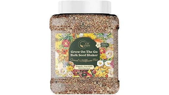 The image shows a vibrant garden bed filled with colorful blooming annual plants thriving in full sun.