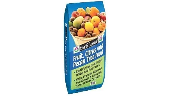 The image shows a close-up of a pecan tree with lush green leaves, suggesting good health from fertilizer.