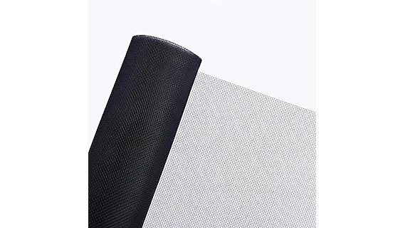 The image shows a bright, inviting screened-in porch with comfortable seating and lush plants.