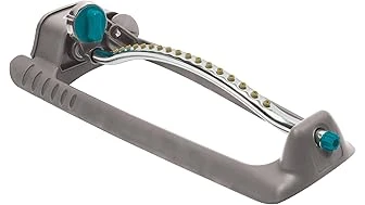 The image shows a well-watered, small rectangular lawn with several different sprinkler heads in view.