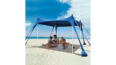 The image shows a robust beach canopy providing shade and protection on a breezy day, ideal for windy conditions.