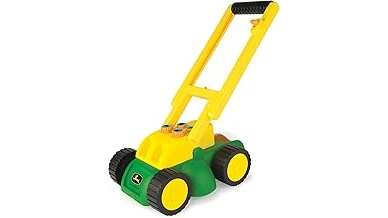 The image shows a powerful riding mower tackling a steep, grassy incline with ease.