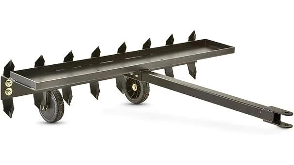 This image shows a powerful pull-behind mower attached to a utility vehicle, perfect for lawn care.