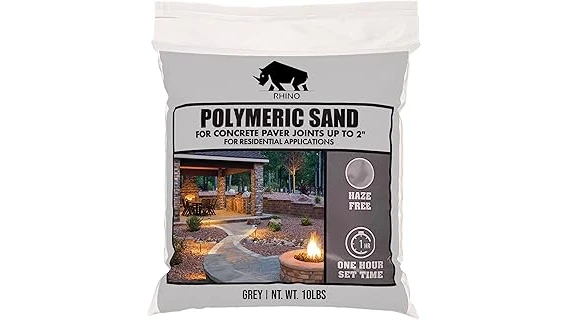 The image shows a pile of leveling sand ready for use on a lawn.