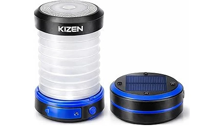 This image shows a selection of popular solar lanterns for camping glowing brightly in a natural setting.