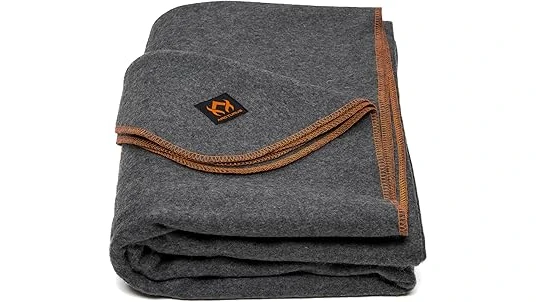 The image shows a cozy, warm blanket ideal for cold weather camping.