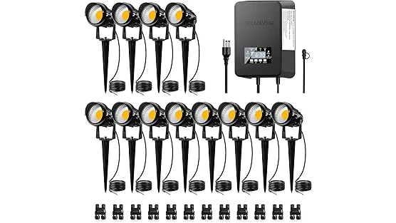 The image shows a beautifully lit garden path with strategically placed low voltage landscape lighting kits.