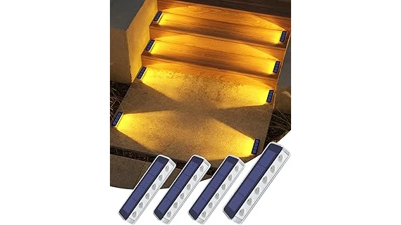 The image shows bright solar walkway lights illuminating a garden path at dusk.