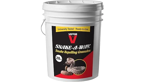 The image shows a collection of snake repellent products arranged for review on a lawn.