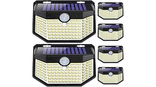 The image shows a collection of bright, modern solar lights illuminating a dark outdoor space beautifully.