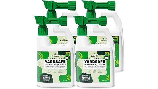 The image shows a yard treatment device effectively dispersing mosquito repellent in a backyard setting.