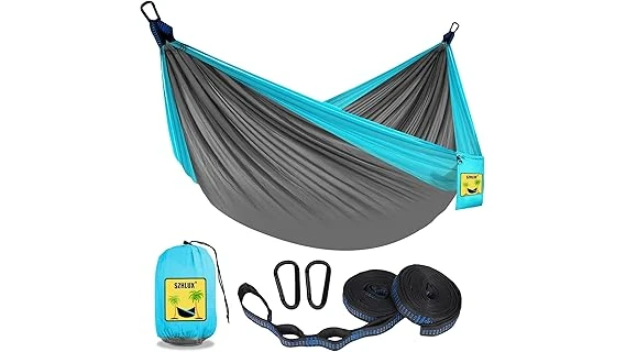 This image shows a comfortable hammock set up outdoors, perfect for relaxing and sleeping.
