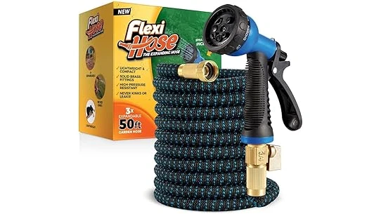 The image shows a flexible, lightweight expandable garden hose uncoiled and ready for watering plants.