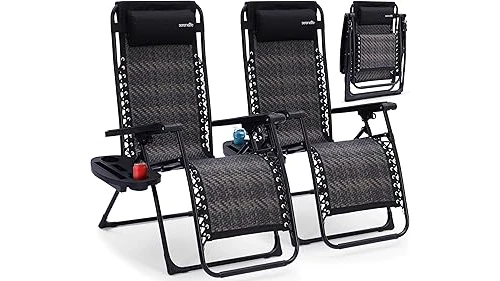 The image shows a comfortable zero gravity outdoor chair set up in a backyard setting.