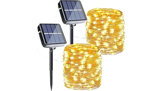 The image shows a garden path illuminated by strings of solar fairy lights, highlighting popular outdoor lighting.