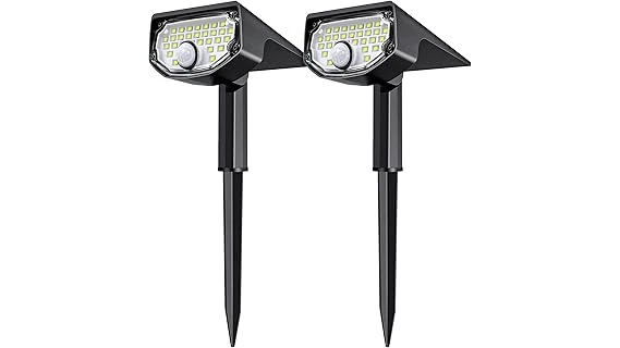 The image shows a variety of motion sensor solar lights illuminating a dark outdoor path.